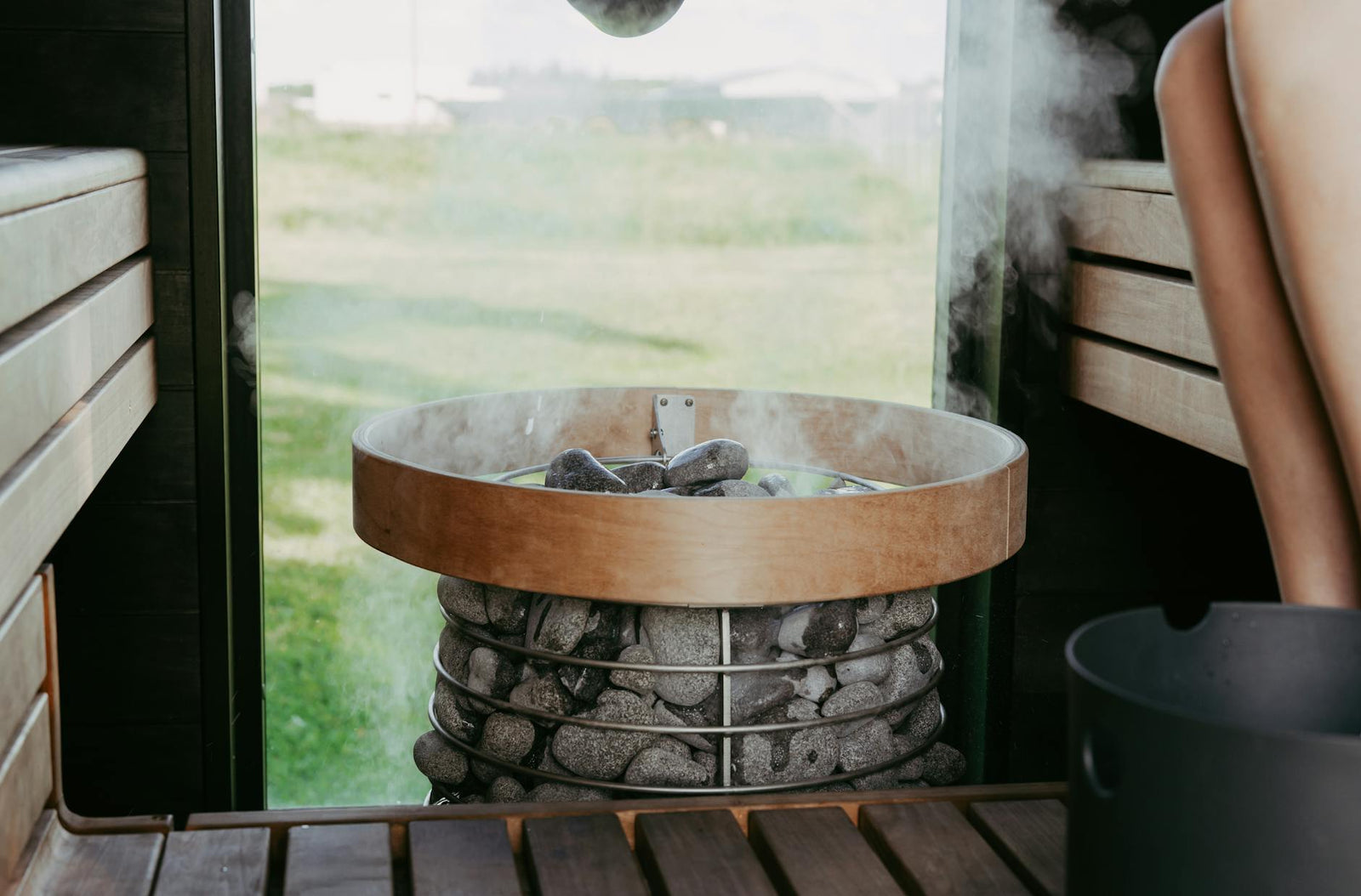 Steam rising from sauna stones.