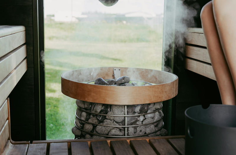 Steam rising from sauna stones.