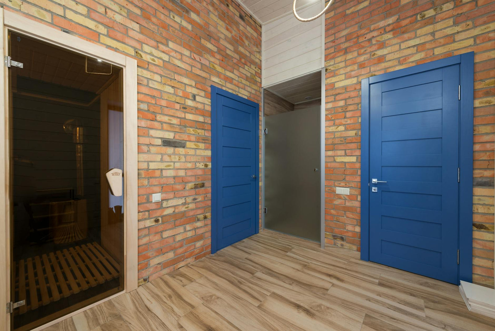 The interior of a wood-lined sauna cabin.